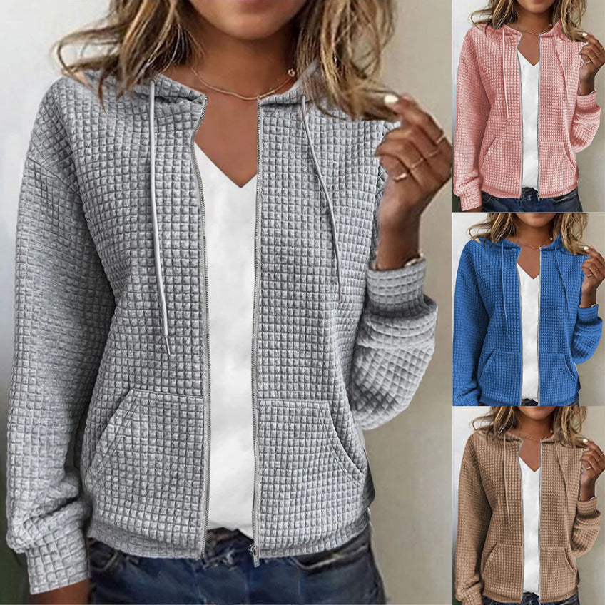 Women's waffle-textured hooded jacket with practical pockets and a modern cut, size S