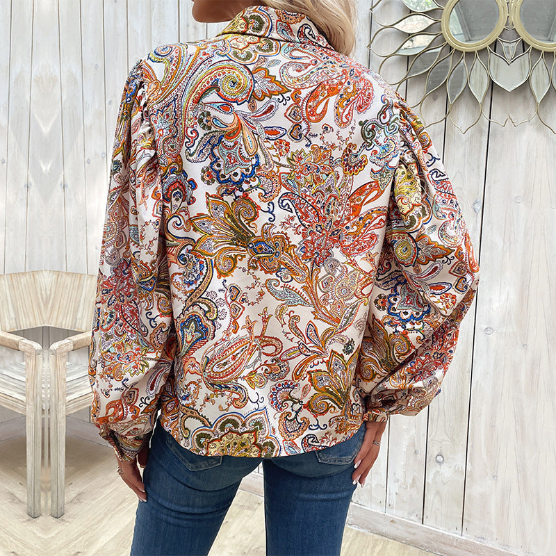 Women's blouse with a striking paisley pattern and voluminous puff sleeves, size [size missing]