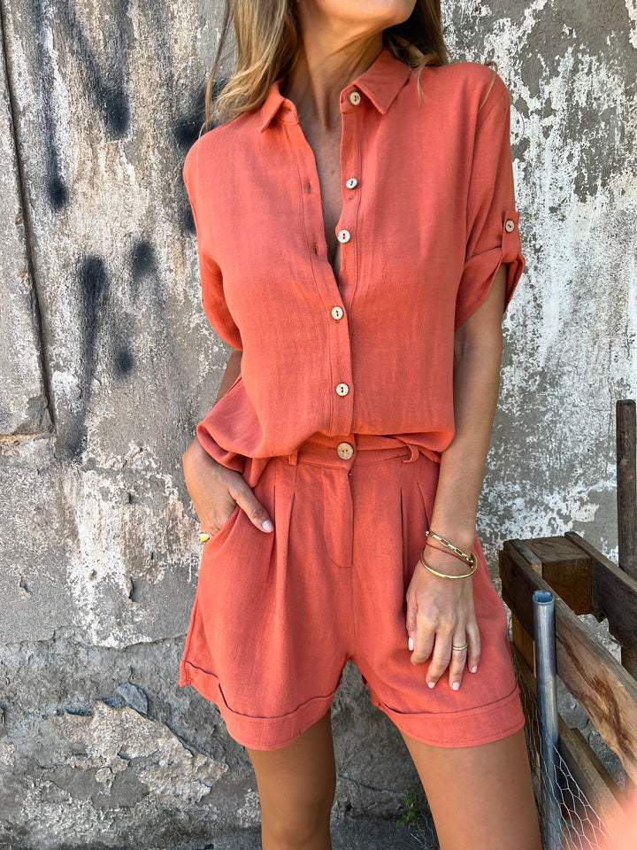 Women's casual jumpsuit with button-fastened top and practical drawstring waist