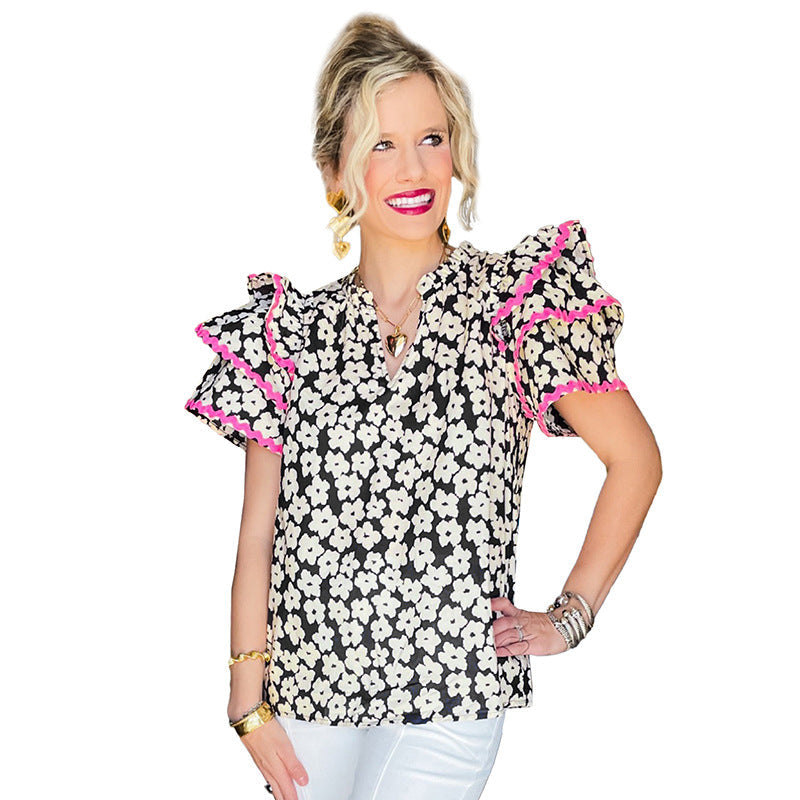 Women's top with striking floral pattern and ruffles, size
