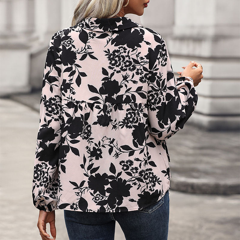 Women's blouse with floral design and decorative lacing detail, size