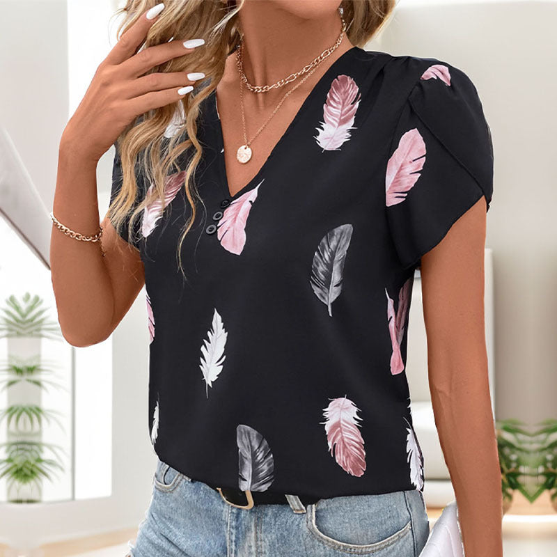 Women's blouse with romantic feather pattern and puff sleeves, size