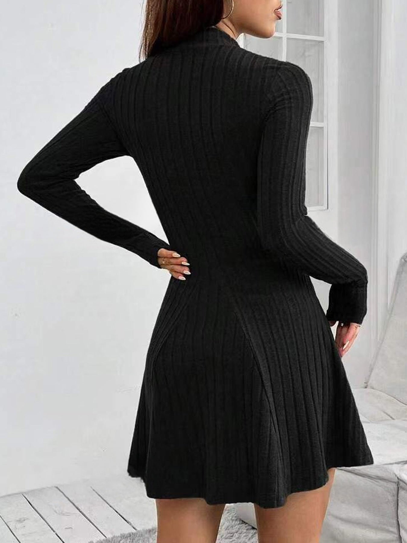 Women's knitted dress with a structured design and long sleeves, size