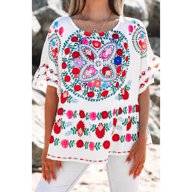 Women's embroidered blouse top with voluminous sleeves and floral motifs, size [size missing]