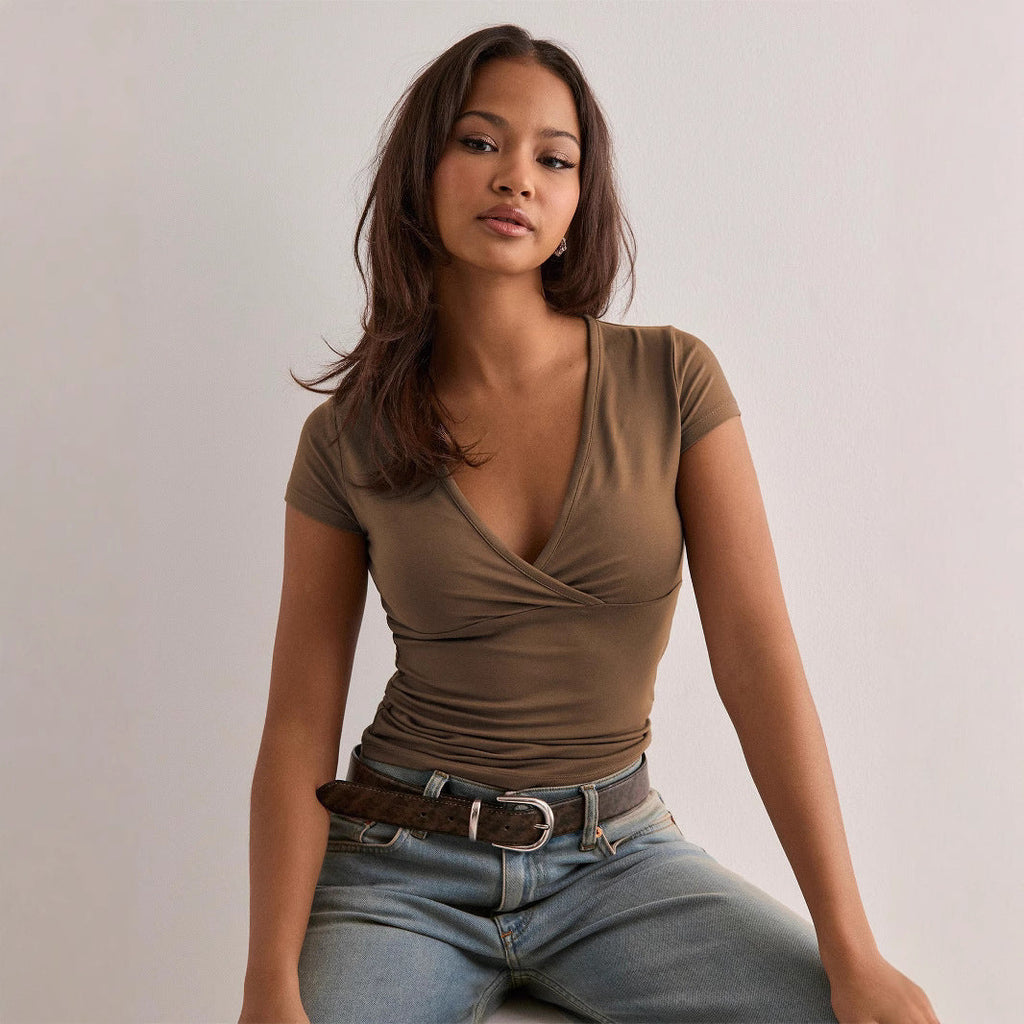Women's wrap top with elegant ruching and figure-hugging cut, size S