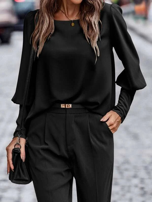 Women's blouse with elegant puff sleeves and flowing fabric, size S