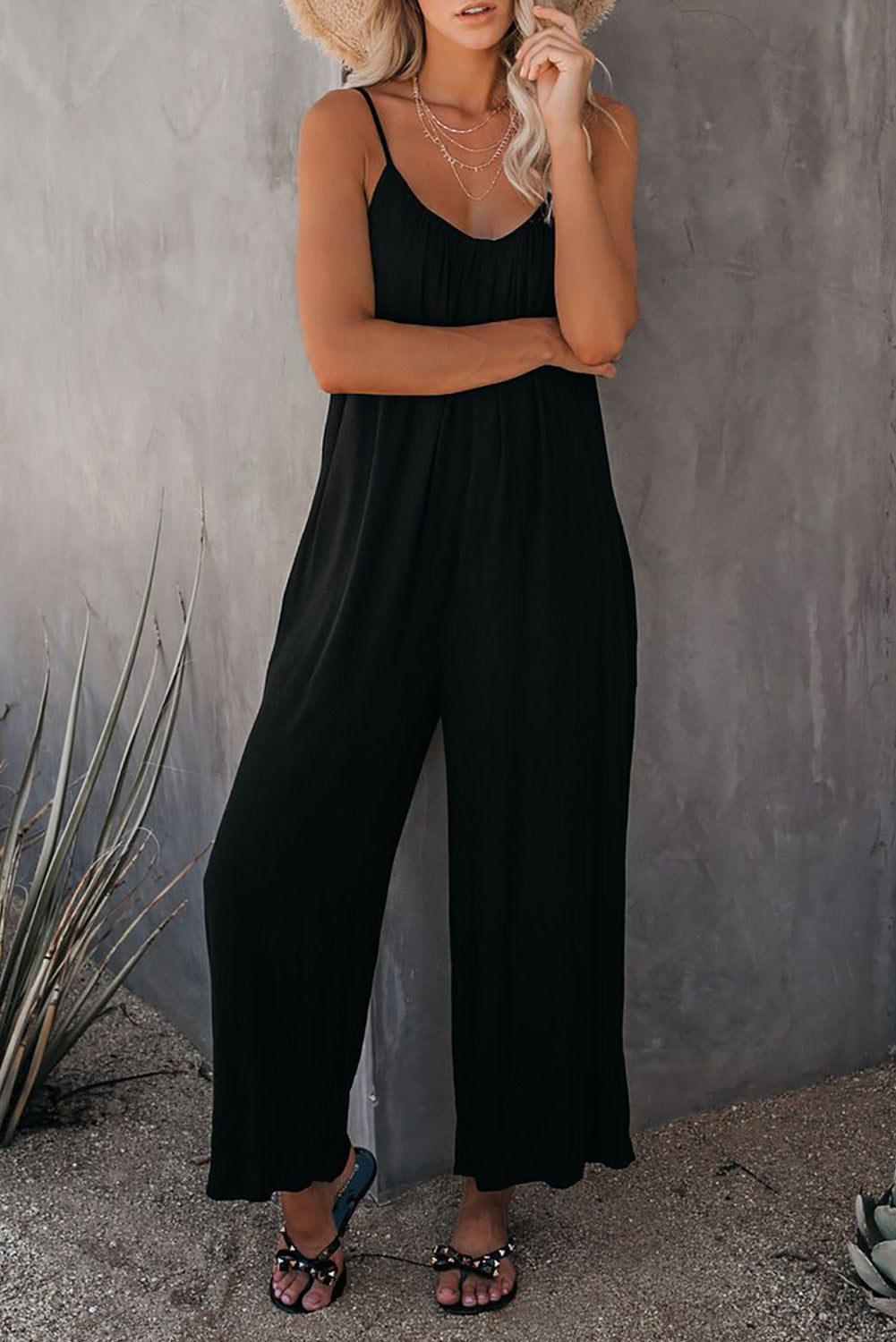 Women's casual jumpsuit with decorative straps and light, flowing fabric, size S