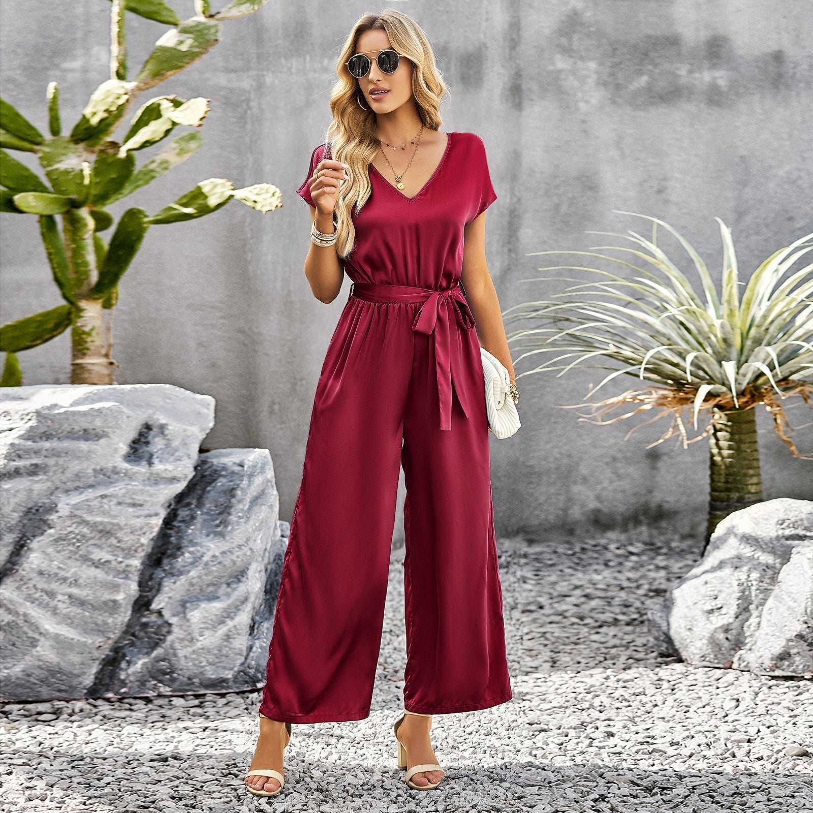 Women's elegant jumpsuit with V-neck and tie belt, size