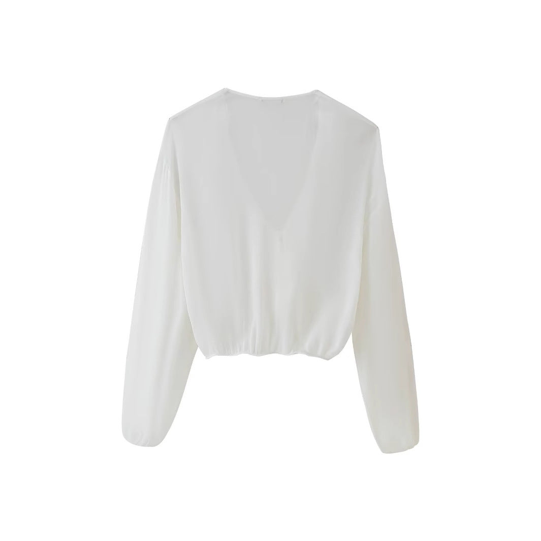 Women's blouse with romantic ruffles and deep V-neck, size