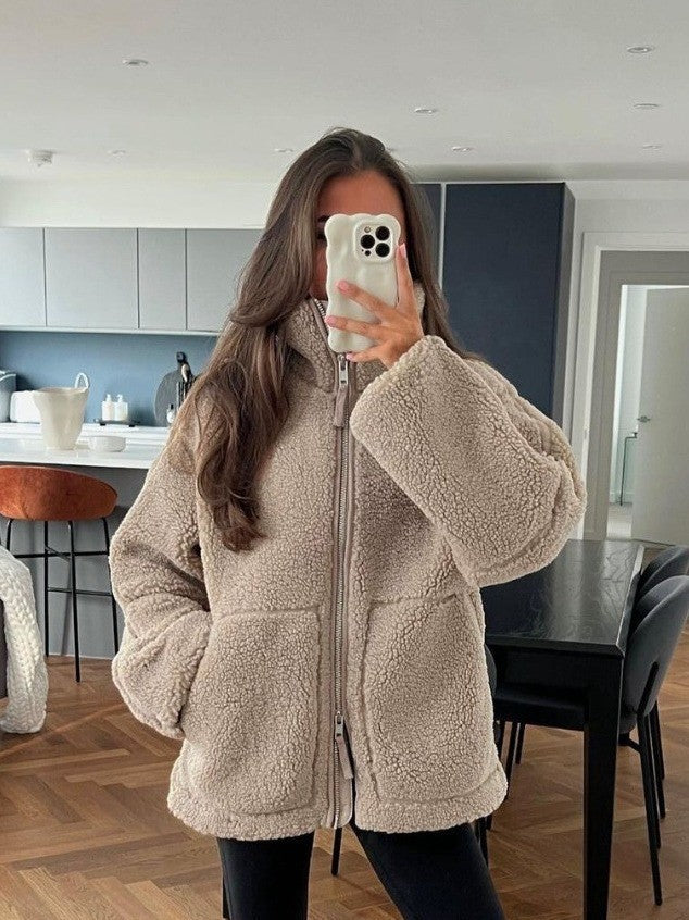 Women's cozy fleece jacket with high collar and practical pockets, size