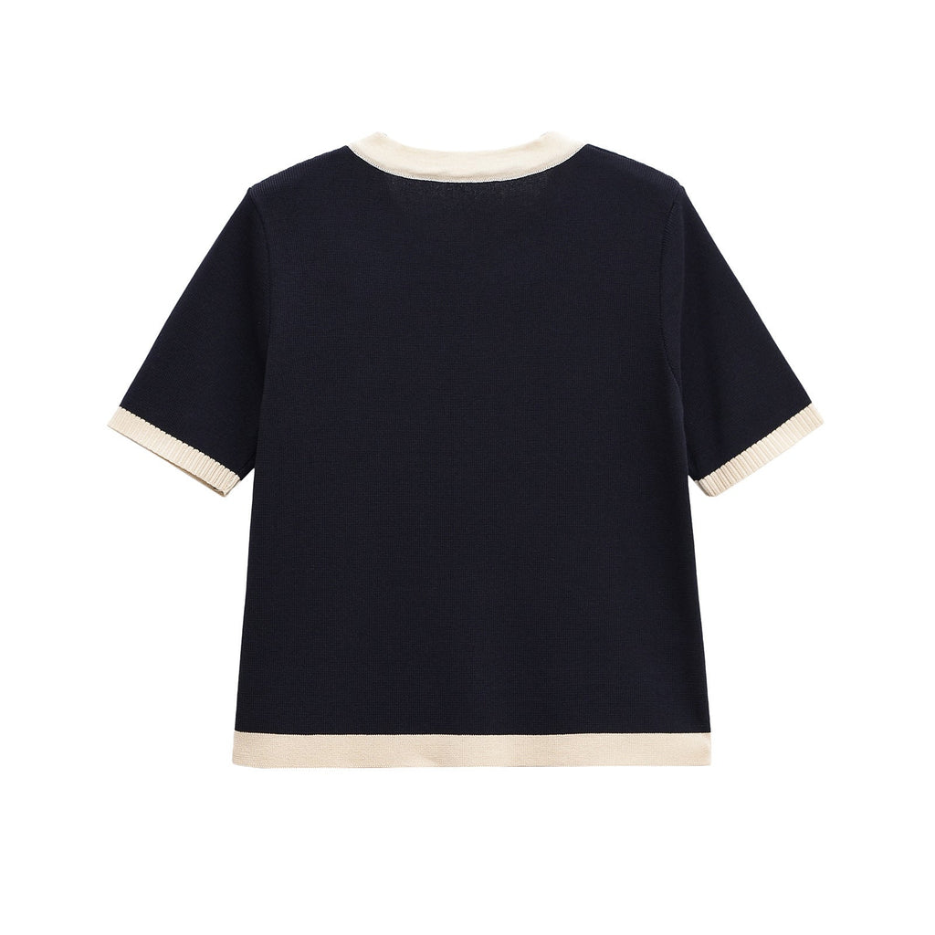 Women's short-sleeved knit top with decorative buttons and modern design, size S