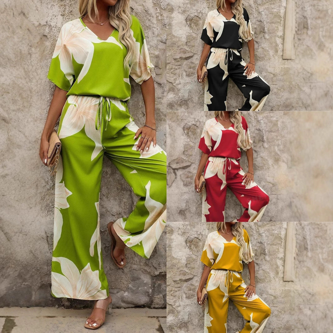 Women's relaxed jumpsuit with floral design and elasticated waistband, size