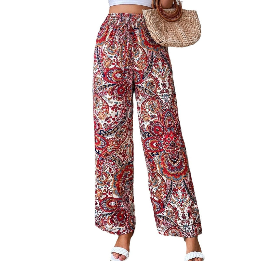 Women's wide-leg palazzo trousers with elasticated waistband and elegant paisley pattern, size S