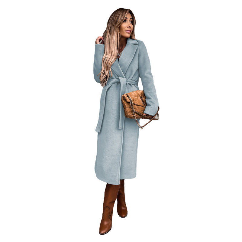 Women's elegant wool coat with tailored cut and belt, size S