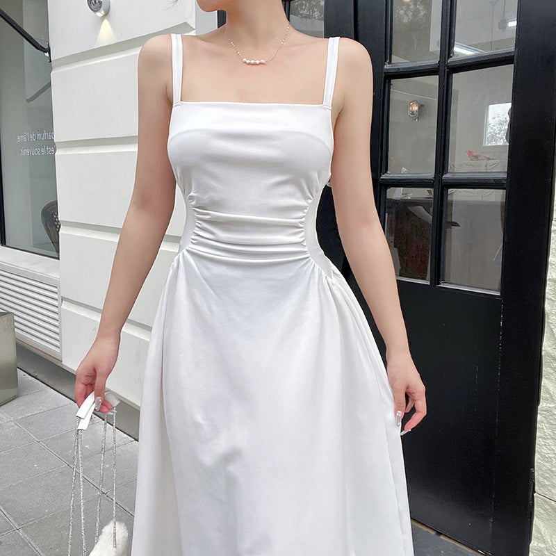 Women's elegant spaghetti strap midi dress with a figure-hugging silhouette and sophisticated draping, size [size]