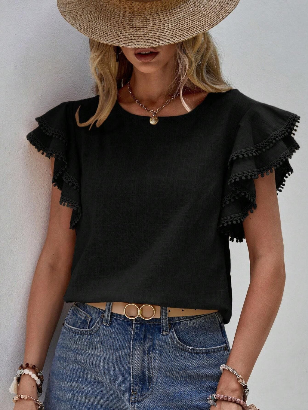 Women's lightweight top with playful ruffles and decorative hem, size [size]
