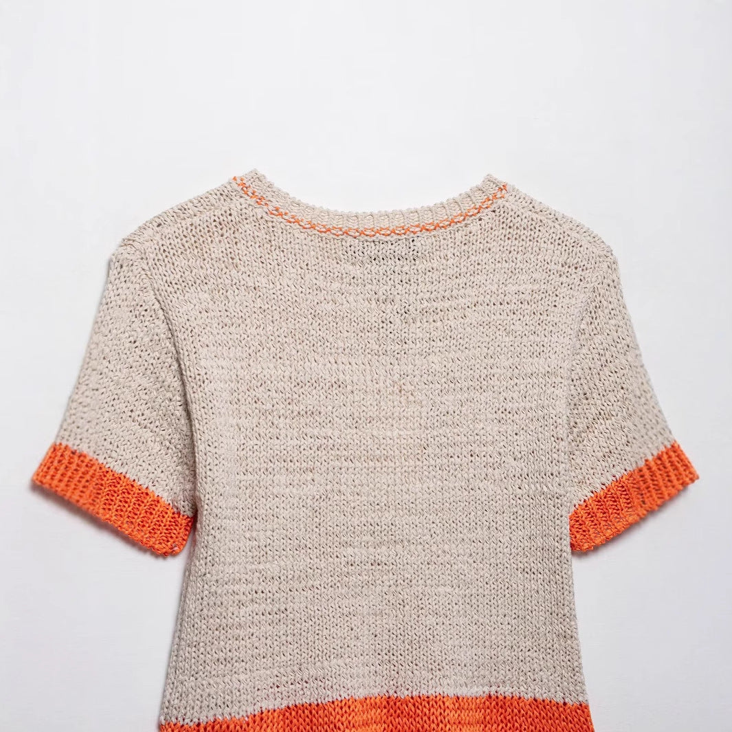 Women's knit top with contrasting color accents and a relaxed fit, size S