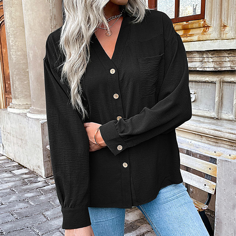 Women's blouse with a relaxed fit and decorative button details, size [size missing]