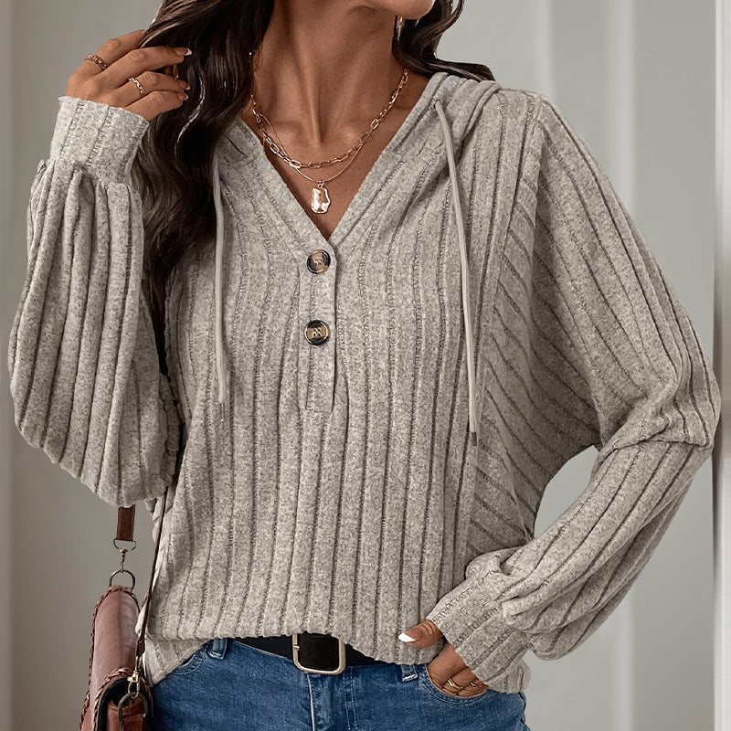 Women's hooded sweater with structured rib design and elegant button details, size S