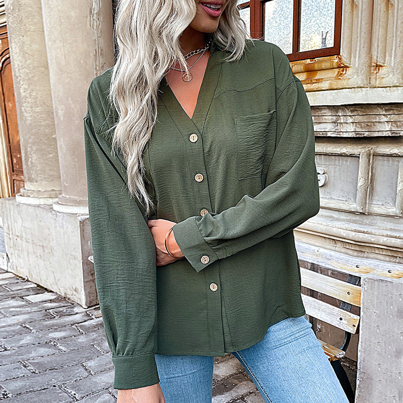 Women's blouse with a relaxed fit and decorative button details, size [size missing]