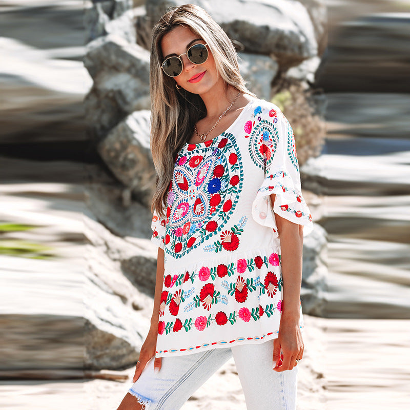 Women's embroidered blouse top with voluminous sleeves and floral motifs, size [size missing]