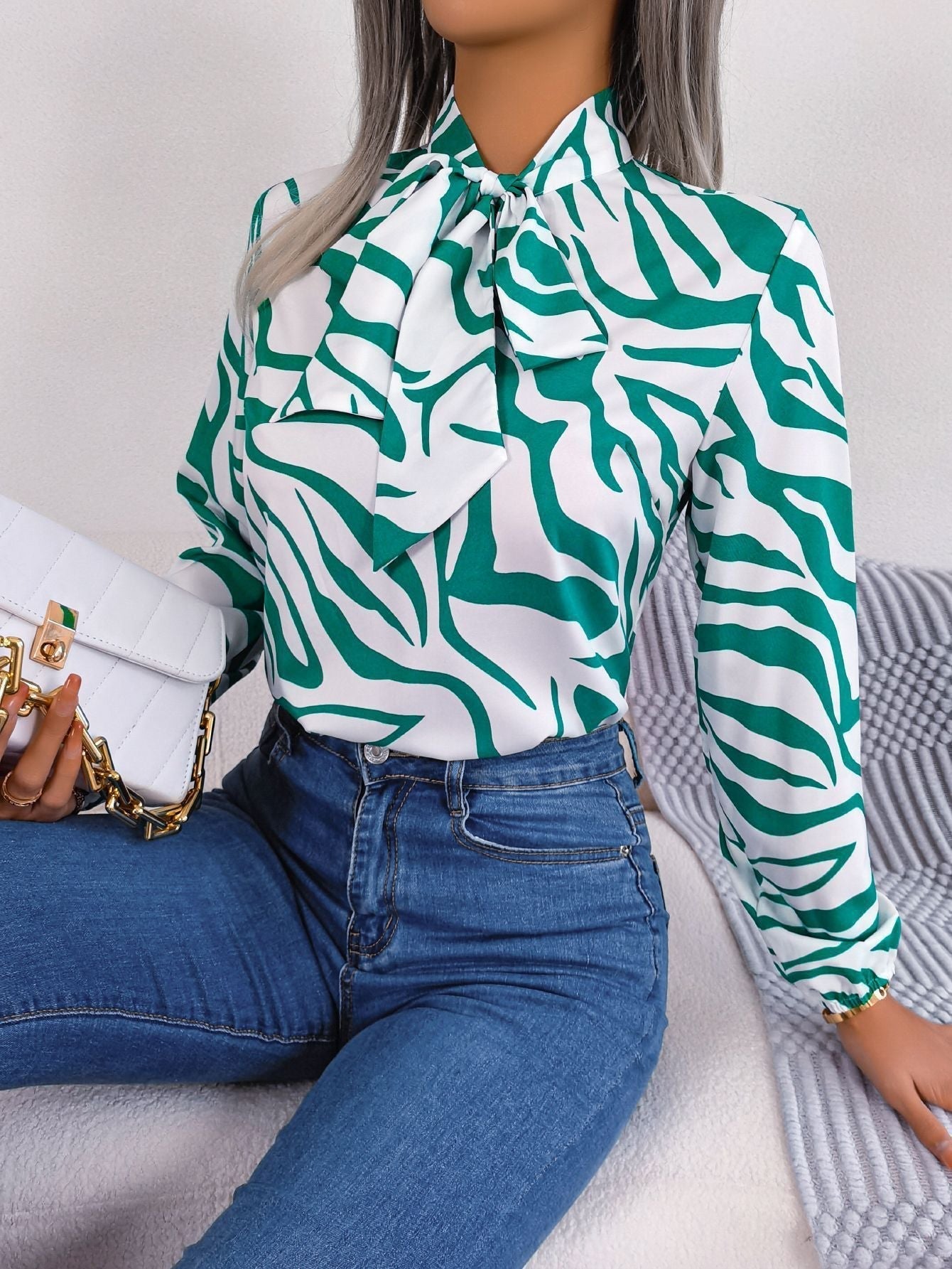 Women's blouse with fashionable zebra pattern and elegant bow collar, size