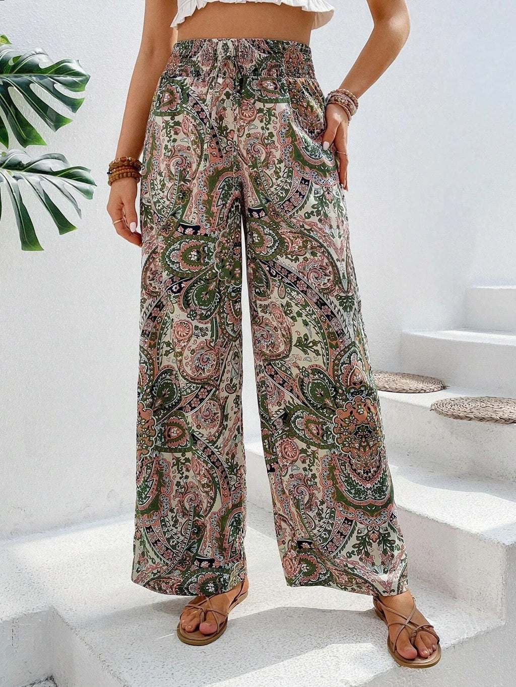 Women's wide-leg palazzo trousers with elasticated waistband and elegant paisley pattern, size S