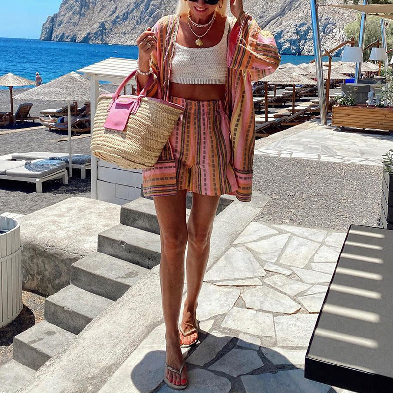 Women's casual top with a relaxed knit look and striped shorts, size S