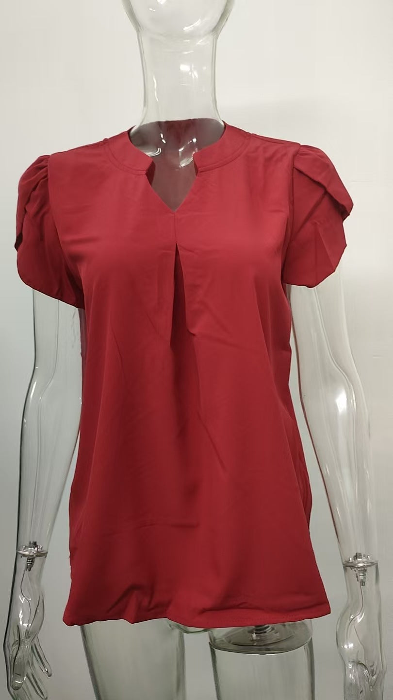 Damenbluse mit elegantem V-Ausschnitt-Detail und leichten Puffärmeln, Größe [size]