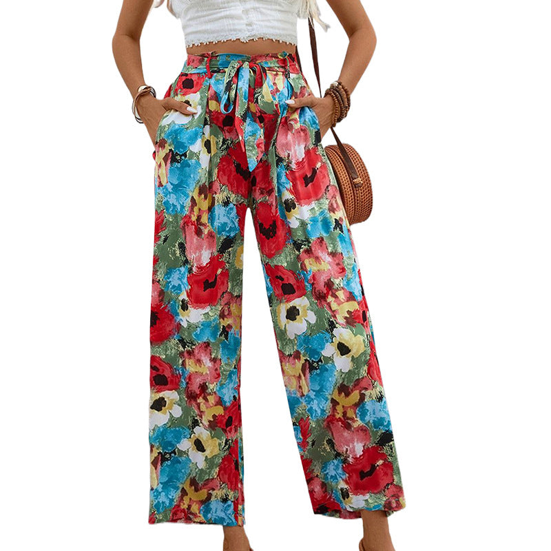 Women's wide-legged summer trousers with a colorful floral pattern and elasticated waistband, size [size missing]