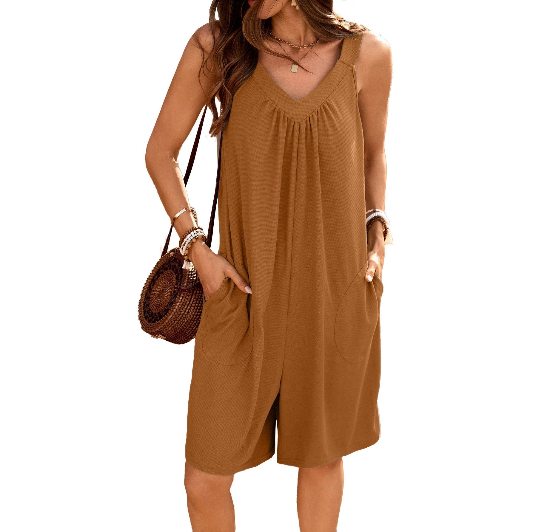 Women's sleeveless jumpsuit with deep V-neck and practical pockets, size S