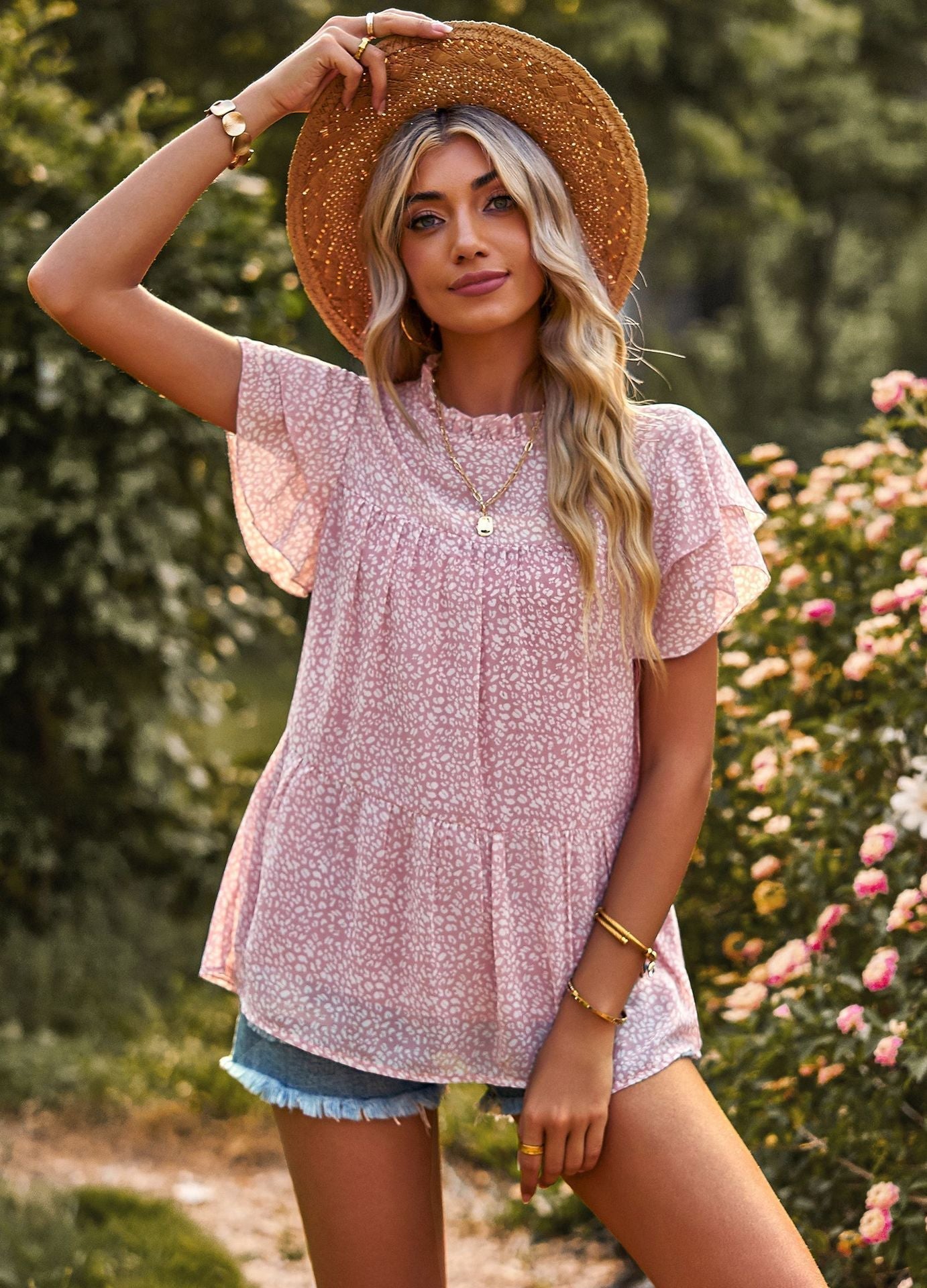 Women's flowy blouse with ruffle details and floral design, size