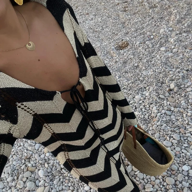 Women's knitted dress with a modern zigzag pattern and deep V-neck, size [size missing]