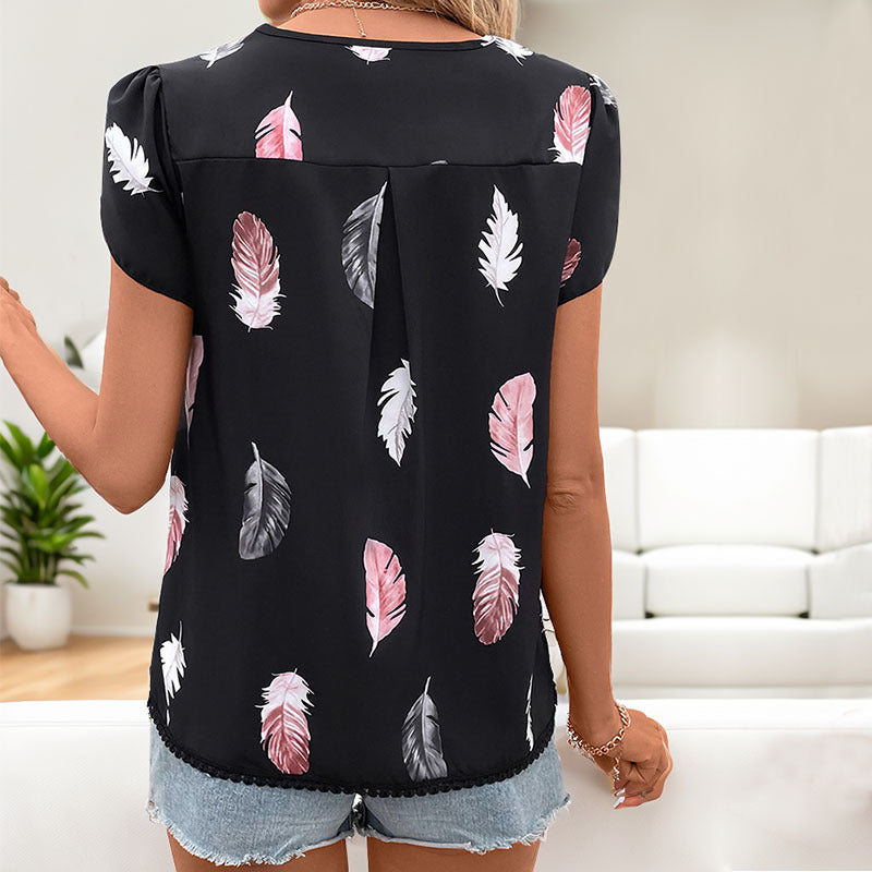 Women's blouse with romantic feather pattern and puff sleeves, size