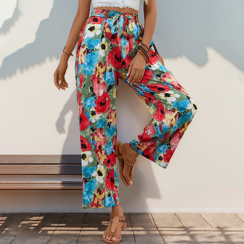 Women's wide-legged summer trousers with a colorful floral pattern and elasticated waistband, size [size missing]