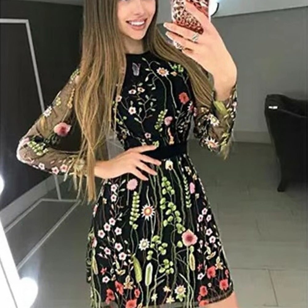 Women's elegant dress with floral embroidery and sheer sleeves, size [size missing]