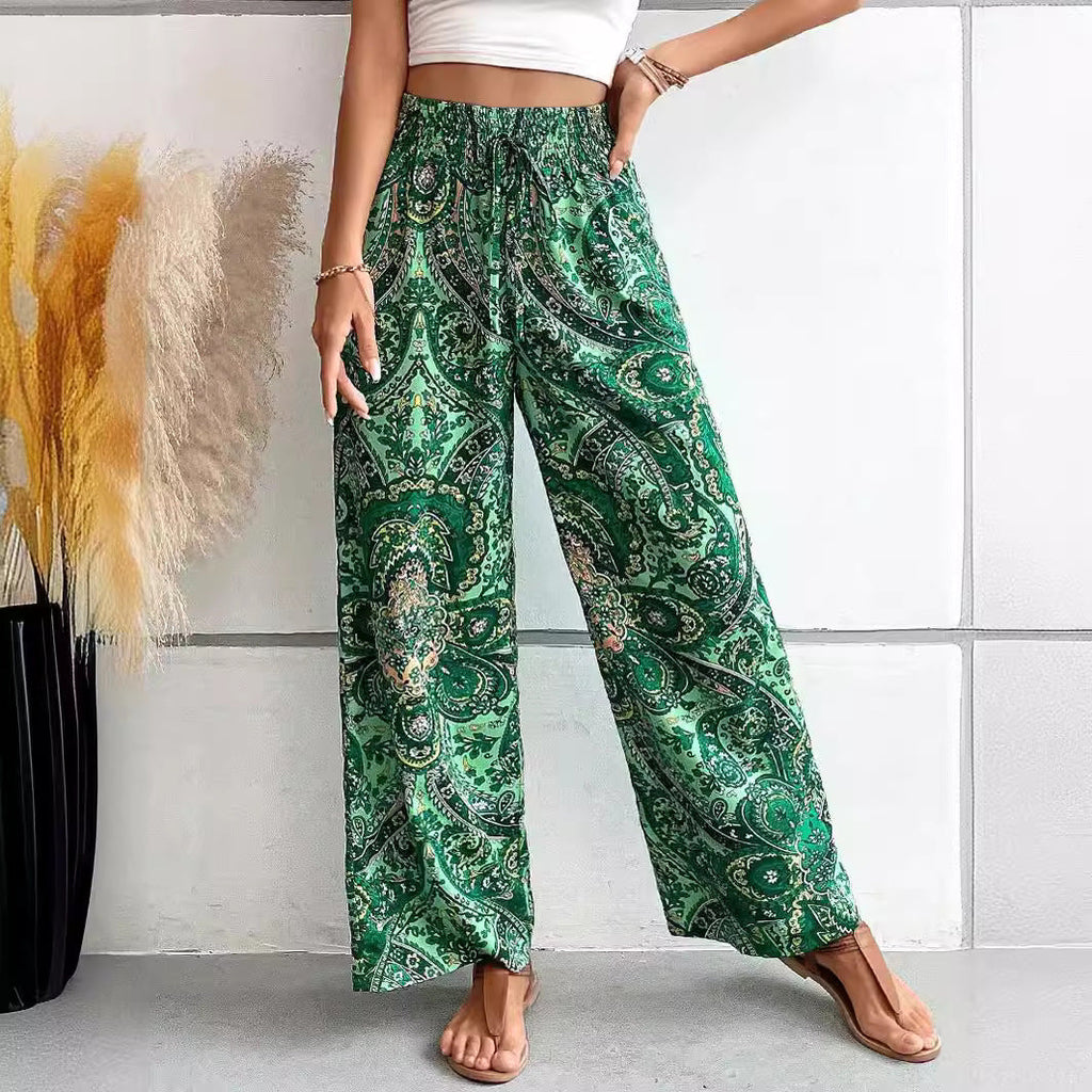 Women's wide-leg palazzo trousers with elasticated waistband and elegant paisley pattern, size S