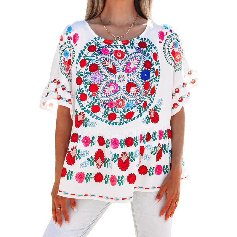Women's embroidered blouse top with voluminous sleeves and floral motifs, size [size missing]
