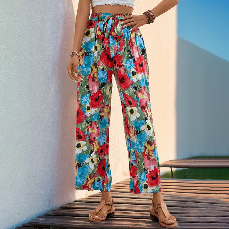 Women's wide-legged summer trousers with a colorful floral pattern and elasticated waistband, size [size missing]