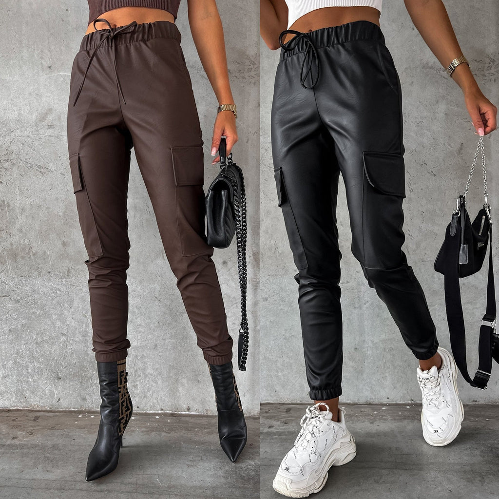 Women's faux leather jogging pants with practical pockets and elastic waistband, size