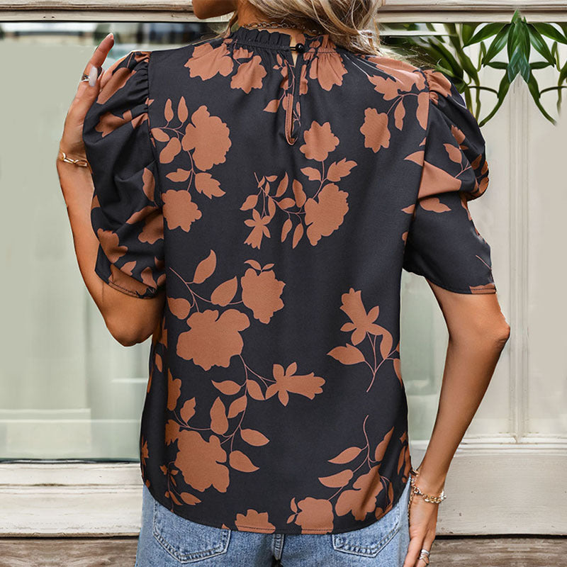 Women's blouse with puff sleeves and floral pattern, size