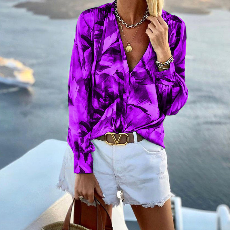 Women's blouse with floral pattern and deep V-neck, size