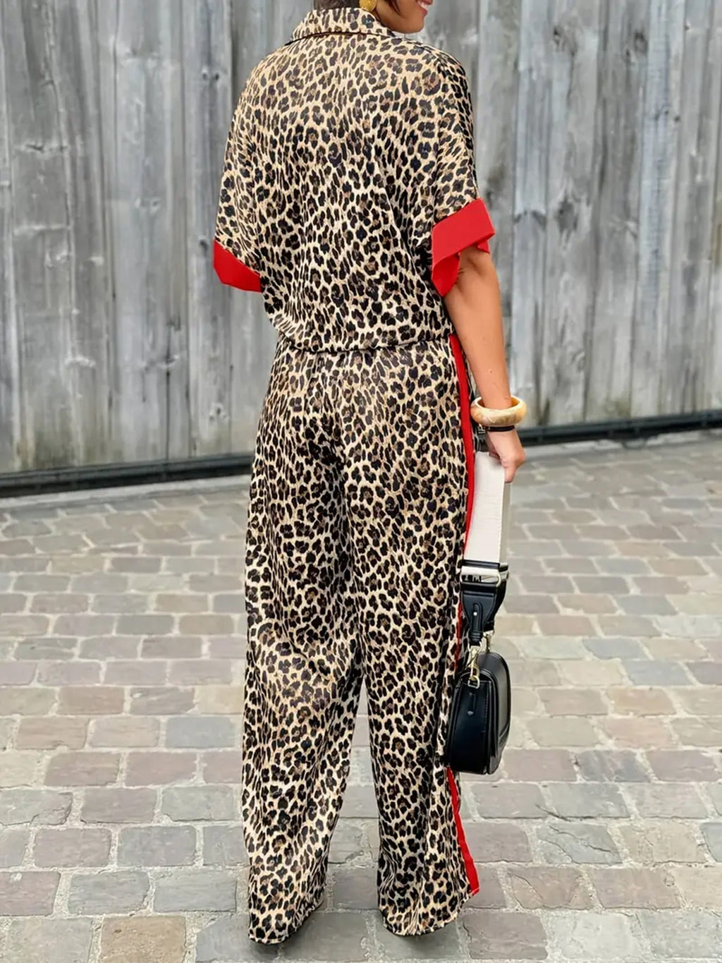 Women's elegant and comfortable linen jumpsuit with leopard print and contrast stripes, size S