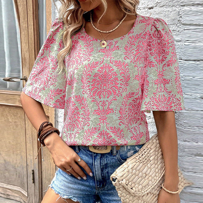 Women's blouse with voluminous sleeves and floral patterns, size