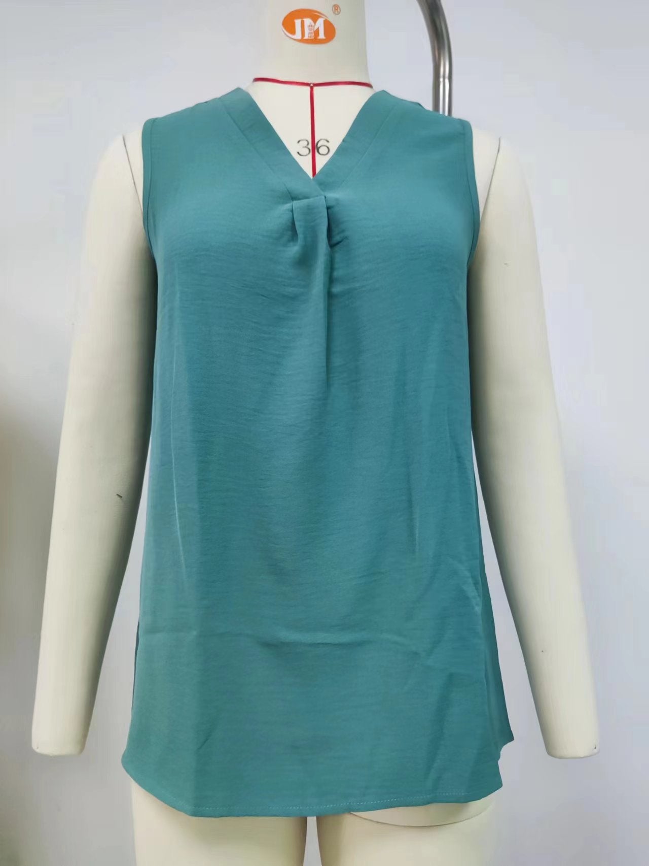 Women's sleeveless blouse with elegant V-neck and decorative pleats, size S