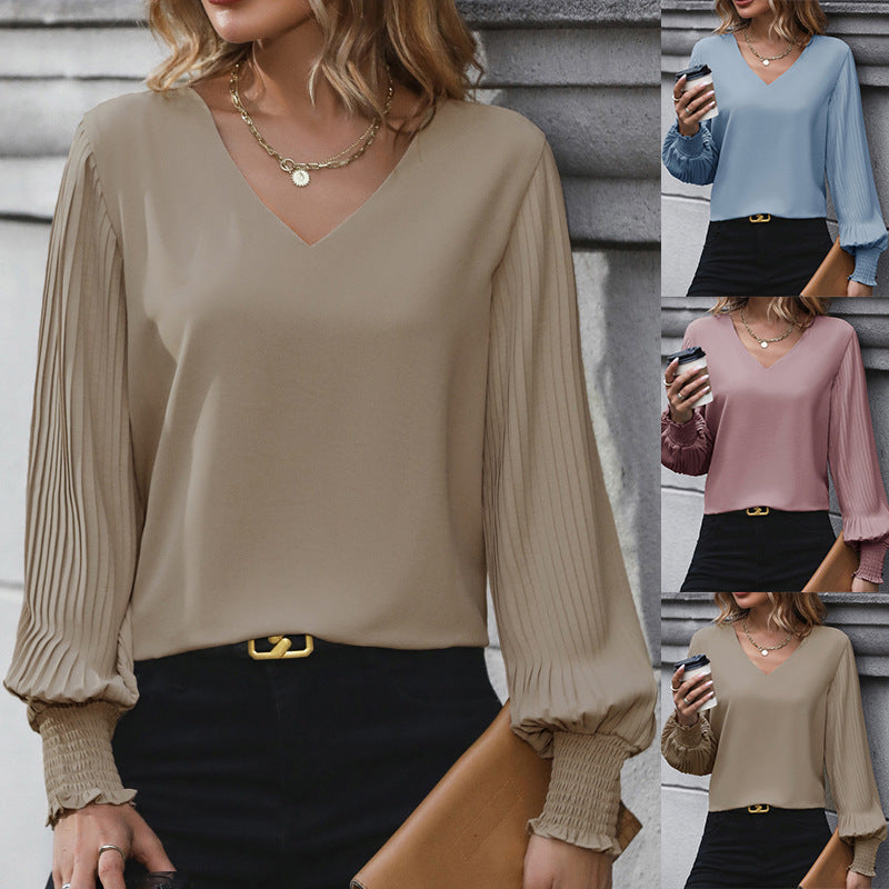 Women's blouse with voluminous pleated sleeves and elegant V-neck, size [size]