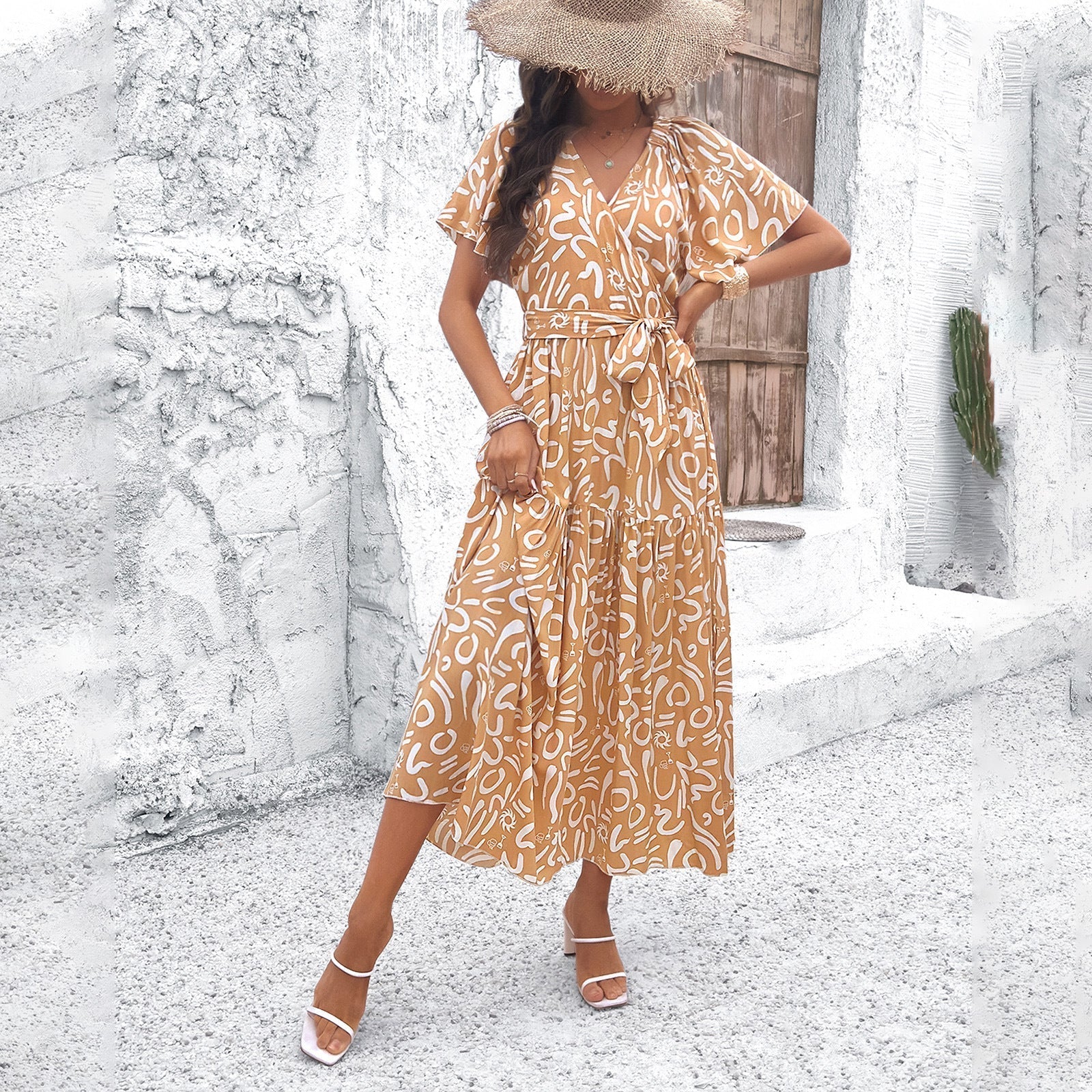 Women's wrap dress with voluminous sleeves and playful pattern, size S