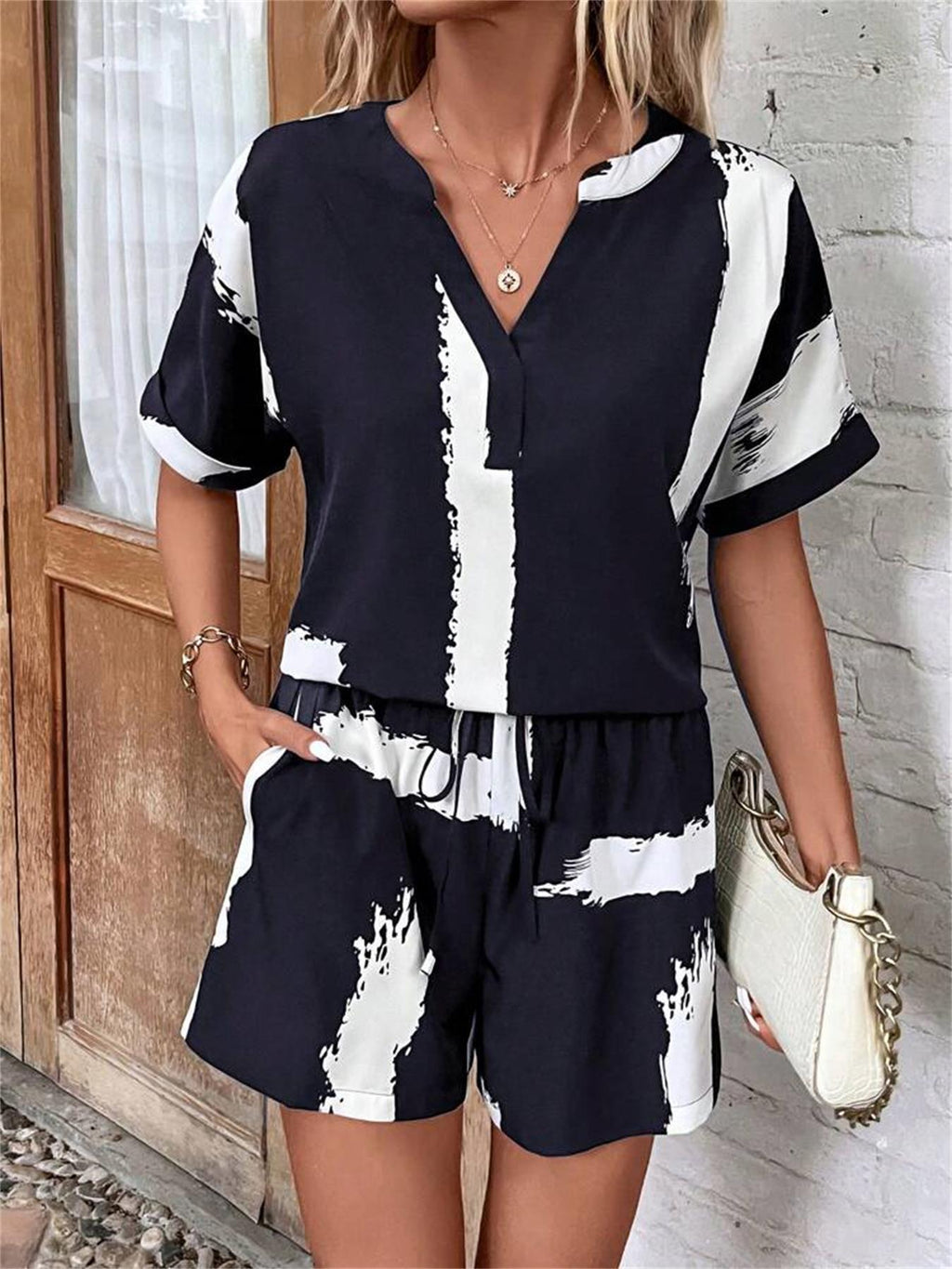 Women's casual short suit with a modern V-neck and stylish pockets, size S