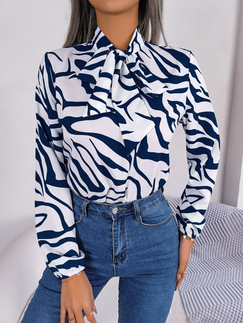 Women's blouse with fashionable zebra pattern and elegant bow collar, size
