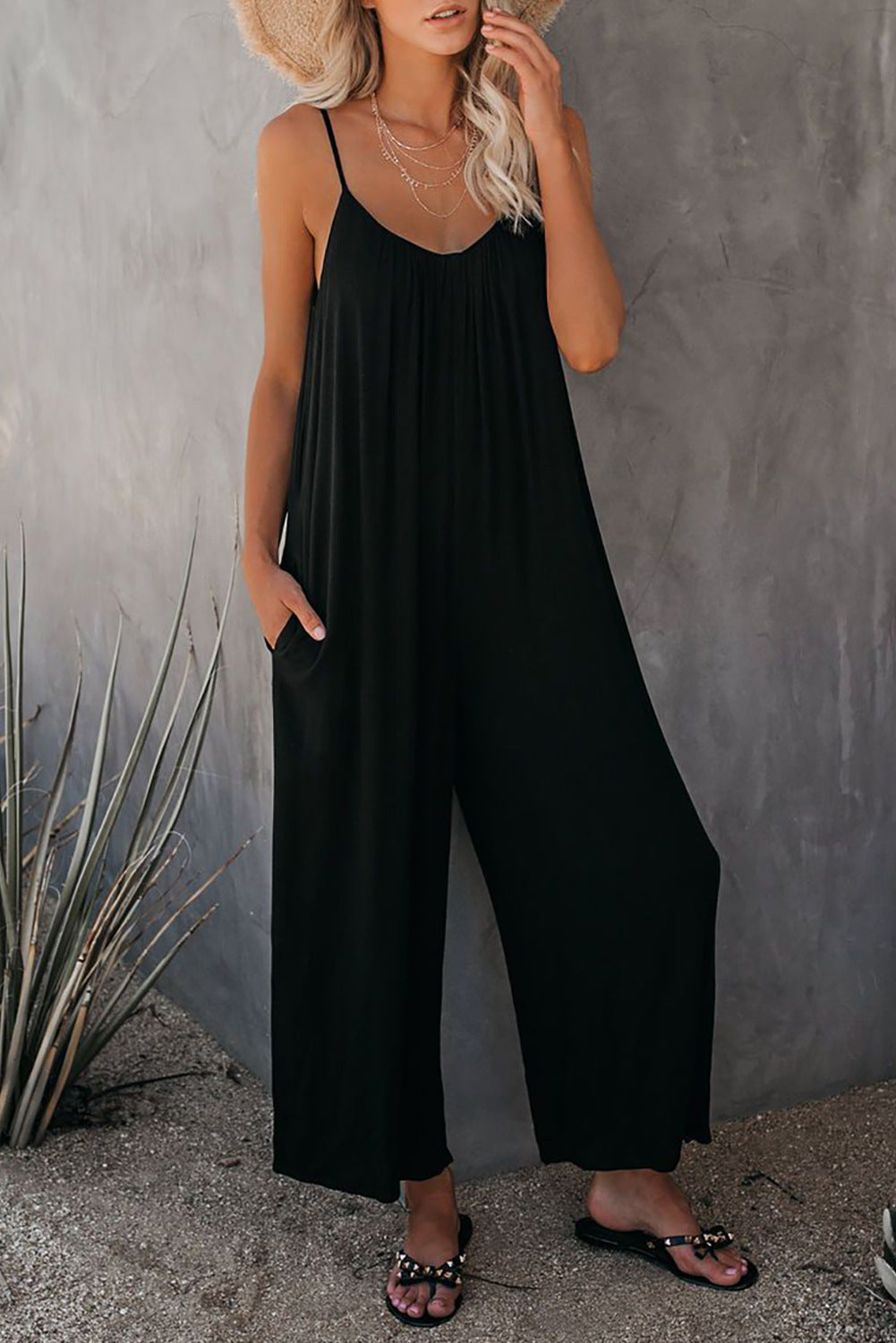 Women's casual jumpsuit with decorative straps and light, flowing fabric, size S